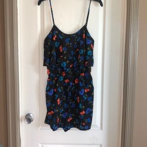 Super cute romper with pockets.